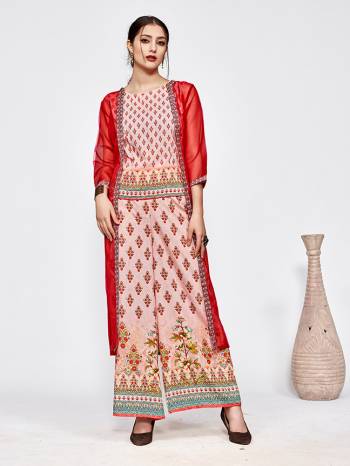 Here Is A Very Pretty Designer Indo-Western Three Piece Set. Its Top And Bottom Are In Baby Pink Color Paired With Red Colored Jacket. It Is Fabricated On Muslin Beautified With Prints All Over Paired With Orgenza Fabricated Jacket. Buy Now.