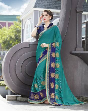 Here Is A Pretty Color Pallete In Shades Of Blue With This Designer Saree In Turquoise Blue Color Paired With Navy Blue Colored Blouse. This Saree Is Fabricated On Georgette Paired With Art Silk Fabricated Blouse. Buy This Saree Now.