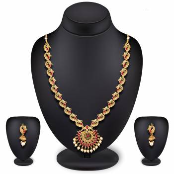 For A Queen Look, Here Is A Designer Royal Looking Necklace Set In Golden Color. This Necklace Set Can Be Paired With Heavy Ethnic Attire For More Enhanced Look. Buy Now