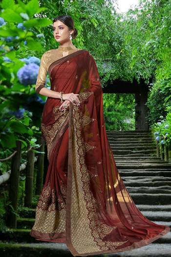 Here Is A Beautiful Queen Look With This Royal Saree In Maroon Color Paired With Beige Colored Blouse. This Saree Is Fabricated On Georgette Paired With Art Silk Fabricated Blouse. It Has Detailed Jari Embroidery Over The Saree Lace Border. Buy This Saree Now.