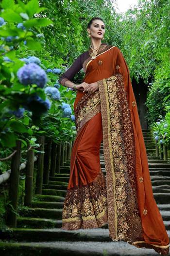 New And Unique Shade In Orange Is Here With This Saree In Rust Orange Color Paired With Contrasting Wine Colored Blouse. This Is Fabricated On Silk Georgette Paired With Art Silk Fabricated Blouse. It Has Heavy Embroidery Over Its Broad Lace Border.