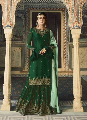 Go With The Lovely Shades Of Green With This Designer Sharara Suit In Dark Green Color Paired With Pastel Green Colored Dupatta. Its Embroidered Top IS Satin Georgette Based Paired With Embroidered Georgette Fabricated Bottom And Dupatta. 