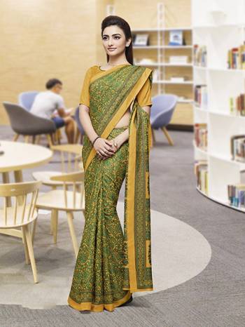 Comfort Is The First Priority When You Go To Your Work Place. So Keeping Your Comfort In Mind This Printed Saree Is Designed As A Uniform For Your Work Place. This Saree And Blouse are Fabricated On Faux Georgette Beautified With Prints Which Is Also Light In Weight And Easy To Carry All Day Long. 