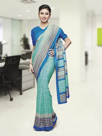 Comfort Is The First Priority When You Go To Your Work Place. So Keeping Your Comfort In Mind This Printed Saree Is Designed As A Uniform For Your Work Place. This Saree And Blouse are Fabricated On Faux Georgette Beautified With Prints Which Is Also Light In Weight And Easy To Carry All Day Long. 