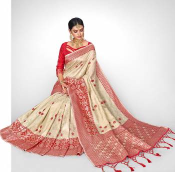 This Festive Season Look The Most Elegant Of All Wearing This Designer Silk based Saree Beautified With Weave All Over. This Saree Is Light Weight, Durable And Easy To Carry Throughout The Gala