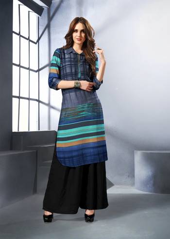 Grab This Readymade Kurti In Shades Of Blue. This Pretty Kurti Is Fabricated On Rayon Beautified With Prints All Over. Buy This Now.