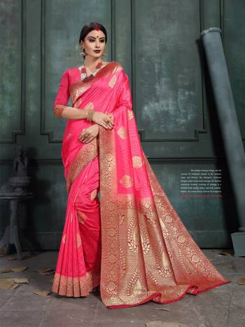 Look Pretty In This Designer Silk Based Saree Beautified With Weave All Over. Its Rich Fabric And Unique Weave Pattern Will Earn You Lots Of Compliments From Onlookers.