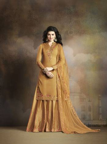 Celebrate This Festive Season Wearing This Designer Suit In Msuturd Yellow Color Paired With Musturd Yellow Colored Bottom And dupatta. Its Embroidered Top And Bottom Are Fabricated On Soft Silk Paired With Net Fabricated Dupatta. Buy Now.