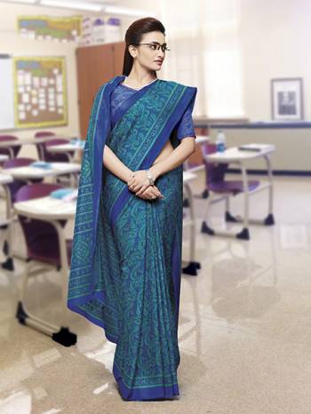 No More Worry For What To Wear At Your Place, Grab This Satin Silk Fabricated Saree And Blouse Beautified With Prints All Over. This Saree Can Be Used As Uniform At Different Places Like Airports, Hospitals And Hotels