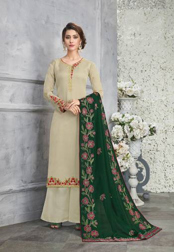 Simple And Elegant Looking Designer Suit Is Here In Pastel Green Color Paired With Contrasting Dark Green Colored Dupatta. Its Top Is Fabricated On Silk Georgette Paired With Santoon Bottom And Soft Silk Fabricated Dupatta. Its Top And Dupatta Are Beautified With Heavy Contrasting Embroidery. 