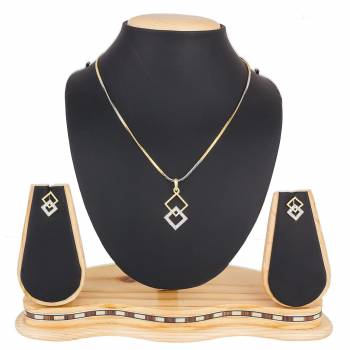 Grab This Very Pretty, Rich And Elegant Looking Designer Pendant Set In Golden And Silver Color. This Pretty Set Is Beautified With Attractive Diamond Work. Buy Now.