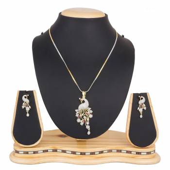 Grab This Very Pretty, Rich And Elegant Looking Designer Pendant Set In Golden And Silver Color. This Pretty Set Is Beautified With Attractive Diamond Work. Buy Now.