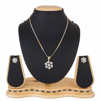 Grab This Very Pretty, Rich And Elegant Looking Designer Pendant Set In Golden And Silver Color. This Pretty Set Is Beautified With Attractive Diamond Work. Buy Now.