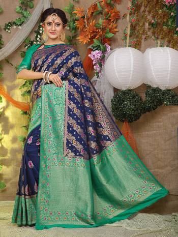 Look Pretty In This Designer Silk Based Saree Beautified With Weave All Over. Its Rich Fabric And Unique Weave Pattern Will Earn You Lots Of Compliments From Onlookers.