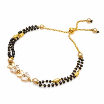 Grab This New And Trendy Mangalsutra Bracelet In Golden And Black Color. This Pretty Bracelet Can Be Paired With Any Kind Of Attire And Can Be Used As Daily Wear Instead Of Mangalsutra.