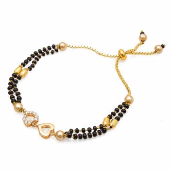 Grab This New And Trendy Mangalsutra Bracelet In Golden And Black Color. This Pretty Bracelet Can Be Paired With Any Kind Of Attire And Can Be Used As Daily Wear Instead Of Mangalsutra.