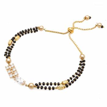 Grab This New And Trendy Mangalsutra Bracelet In Golden And Black Color. This Pretty Bracelet Can Be Paired With Any Kind Of Attire And Can Be Used As Daily Wear Instead Of Mangalsutra.