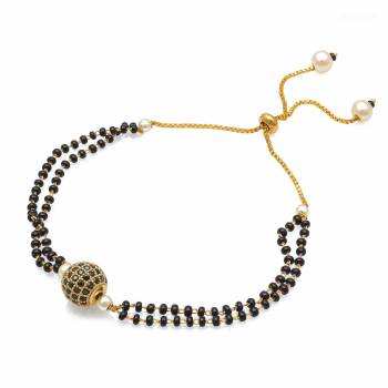 Grab This New And Trendy Mangalsutra Bracelet In Golden And Black Color. This Pretty Bracelet Can Be Paired With Any Kind Of Attire And Can Be Used As Daily Wear Instead Of Mangalsutra.