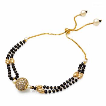 Grab This New And Trendy Mangalsutra Bracelet In Golden And Black Color. This Pretty Bracelet Can Be Paired With Any Kind Of Attire And Can Be Used As Daily Wear Instead Of Mangalsutra.