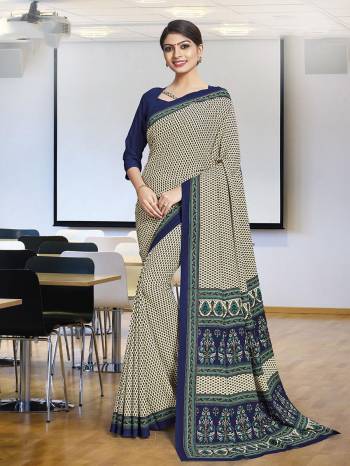 No More Worry For What To Wear At Your Place, Grab This Poly Cotton Fabricated Saree And Blouse Beautified With Prints All Over. This Saree Can Be Used As Uniform At Different Places Like Airports, Hospitals And Hotels