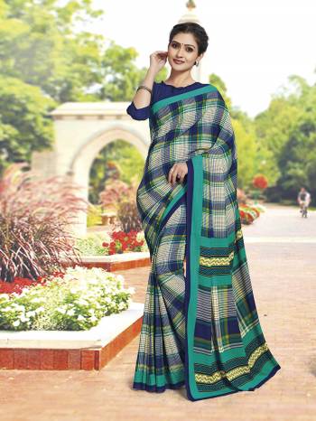 No More Worry For What To Wear At Your Place, Grab This Poly Cotton Fabricated Saree And Blouse Beautified With Prints All Over. This Saree Can Be Used As Uniform At Different Places Like Airports, Hospitals And Hotels