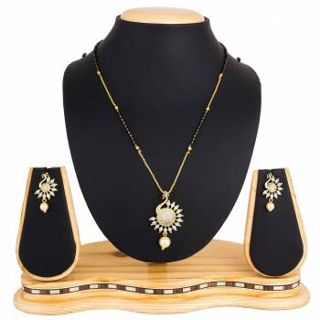 Here Is A New And Unique Patterned Designer Mangalsutra Set In Golden and Silver Color. This Pretty Set Comes A Pretty Pair Of Matching Earrings. It Is Beautified With Attractive Dimaond Work With Unique Designs. Buy Now.