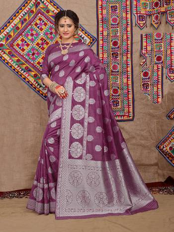 Celebrate This Festive Season With Beauty And Comfort Wearing This Designer Silk Based Saree Is Fabricated On Jacquard Silk Beautified With Attractive Weave Paired With Art Silk Fabricated Blouse
