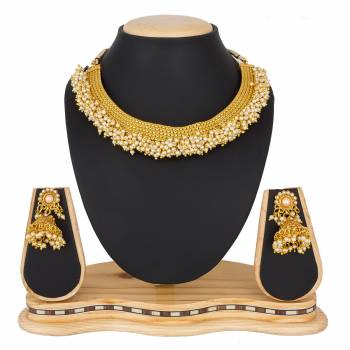 For A Queen Look, Here Is A Designer Royal Looking Necklace Set In Golden Color. This Necklace Set Can Be Paired With Heavy Ethnic Attire For More Enhanced Look. Buy Now