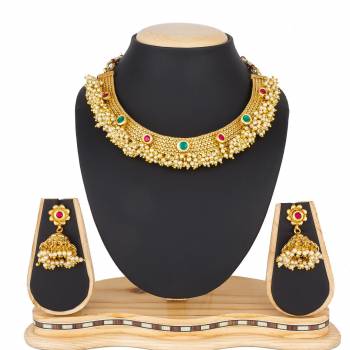 For A Queen Look, Here Is A Designer Royal Looking Necklace Set In Golden Color. This Necklace Set Can Be Paired With Heavy Ethnic Attire For More Enhanced Look. Buy Now