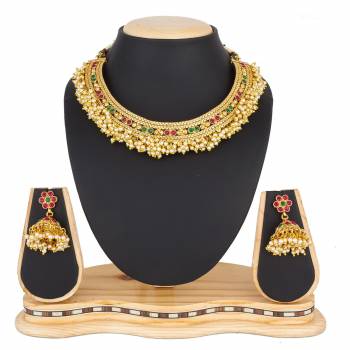 For A Queen Look, Here Is A Designer Royal Looking Necklace Set In Golden Color. This Necklace Set Can Be Paired With Heavy Ethnic Attire For More Enhanced Look. Buy Now