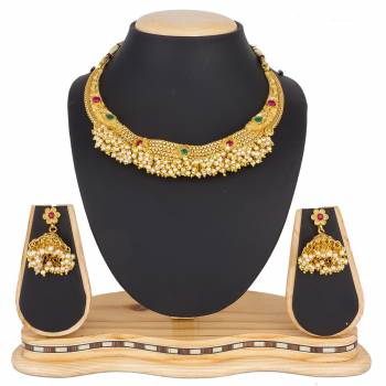 For A Queen Look, Here Is A Designer Royal Looking Necklace Set In Golden Color. This Necklace Set Can Be Paired With Heavy Ethnic Attire For More Enhanced Look. Buy Now