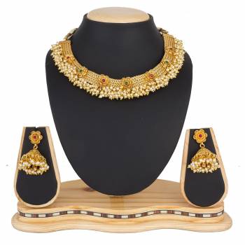 For A Queen Look, Here Is A Designer Royal Looking Necklace Set In Golden Color. This Necklace Set Can Be Paired With Heavy Ethnic Attire For More Enhanced Look. Buy Now