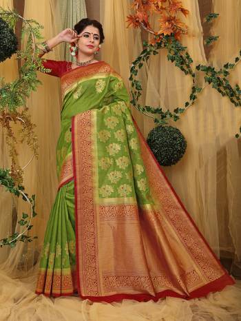 Look Pretty In This Designer Silk Based Saree Beautified With Weave All Over. Its Rich Fabric And Unique Weave Pattern Will Earn You Lots Of Compliments From Onlookers