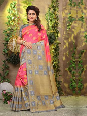 Look Pretty In This Designer Silk Based Saree Beautified With Weave All Over. Its Rich Fabric And Unique Weave Pattern Will Earn You Lots Of Compliments From Onlookers