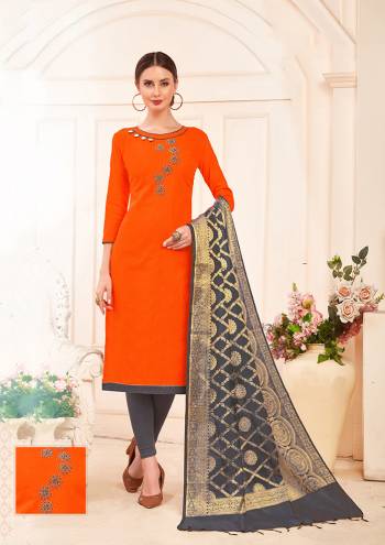 Shine Bright In Designer Dress Material In Orange Colored Top Paired With Contrasting Grey Colored Bottom And Dupatta. This Pretty Hand Embroidered Dress Material Is Cotton Based Paired With Banarasi Art Silk Dupatta.