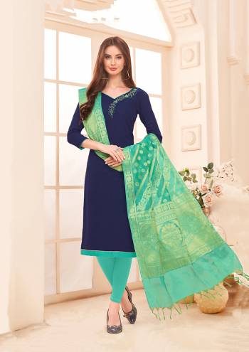 Enhance Your Personality Wearing This Designer Straight Suit In Navy Blue Color Paired With Contrasting Sea Green Colored Bottom And Dupatta, Its Top Is Fabricated On Cotton Slub Paired With Cotton Bottom And Banarasi Art Silk Dupatta. It Is Beautified With Attractive Hand Work Over The Top.