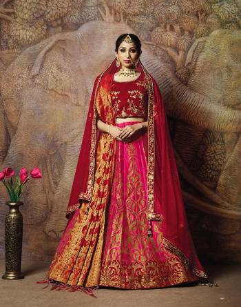 Adorn A Proper Traditional Look Wearing This Heavy Designer Lehenga Choli In Maroon Colored Blouse Paired With Dark Pink Colored Lehenga And Maroon Colored Dupatta. This Lehenga And Blouse Are Fabricated On Jacquard Silk Paired With Brocade Fabricated Blouse. 