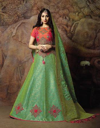 Attract All Wearing This Heavy Designer Lehenga Choli In Orange Colored Blouse Paired With Green Colored Lehenga And Green Colored Dupatta. This Silk Based Lehenga Choli Is Beautified With Heavy Weave And Subtle Embroidery. Its Lehenga And Dupatta Are Fabricated On Jacquard Silk Paired With Art Silk Fabricated Blouse. Buy Now.