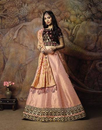 Adorn A Proper Traditional Look Wearing This Heavy Designer Lehenga Choli In Brown Colored Blouse Paired With Baby Pink Colored Lehenga And Baby Pink Colored Dupatta. This Lehenga And Blouse Are Fabricated On Jacquard Silk Paired With Brocade Fabricated Blouse. 