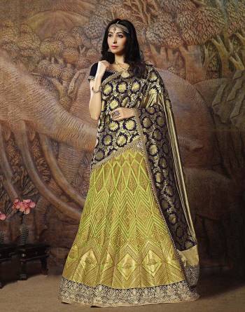 Adorn A Proper Traditional Look Wearing This Heavy Designer Lehenga Choli In Navy Blue Colored Blouse Paired With Light Green Colored Lehenga And Navy Blue Colored Dupatta. This Lehenga And Blouse Are Fabricated On Jacquard Silk Paired With Brocade Fabricated Blouse. 