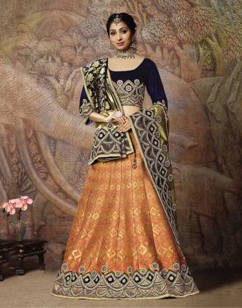 Attract All Wearing This Heavy Designer Lehenga Choli In Navy Blue Colored Blouse Paired With Dark Peach Colored Lehenga And Navy Blue Colored Dupatta. This Silk Based Lehenga Choli Is Beautified With Heavy Weave And Subtle Embroidery. Its Lehenga And Dupatta Are Fabricated On Jacquard Silk Paired With Art Silk Fabricated Blouse. Buy Now.