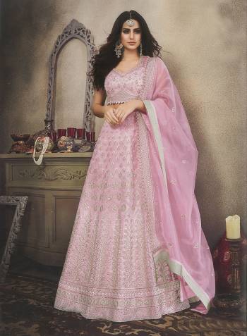 Look Pretty In This Heavy Designer Lehenga Choli In Powder Pink Color. This Lehenga Choli Is Fabricated On Orgenza Beautified With Attractive Embroidery All Over. Also It Is Light In Weight And Easy To Carry Throughout The Gala. 