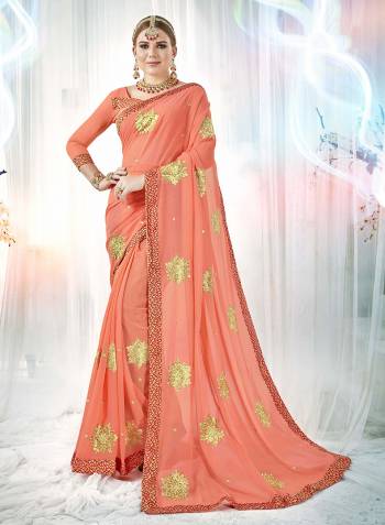 A Must Have Shade In Every Womens Wardrobe Is Here With This Designer Saree In Dark Peach Color Paired With Dark Peach Colored Blouse. This Saree And Blouse are Georgette Based Beautified with Embroidered Butti All Over. Buy This Rich Looking Saree Now.