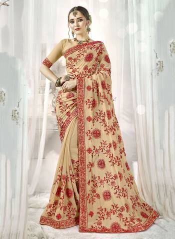 Grab This Attractive Looking Designer Saree In Beige Color Paired With Beige Colored Blouse. This Saree And Blouse are Georgette Based Beautified with Contrasting Resham Embridery And Stone Work. 