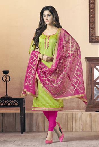 Celebrate This Festive Season With Beauty And Comfort With This Dress, Get This Stitched As Per Your Desired Fit And Comfort. Its Top Is In Light Green Color Paired With Contrasting Rani Pink Colored Bottom And Dupatta. Its Top Is Fabricated On Soft Banarasi Jacquard Paired With Cotton Bottom And Chiffon Fabricated Embroidered Dupatta. 