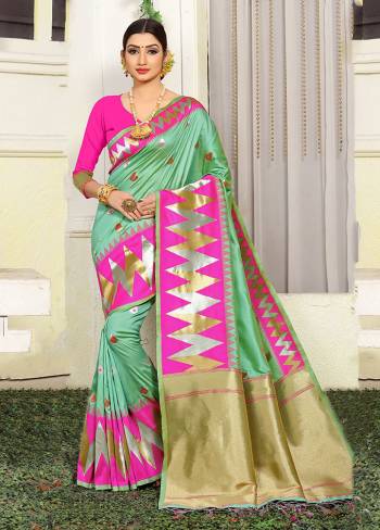 Grab This Very Pretty Designer Silk Based Saree In Light Green Color Paired With Contrasting Rani Pink Colored Blouse. This Saree Is Fabricated On Jacquard Silk Paired With Art Silk Fabricated Blouse Beautified With Weave All Over. 