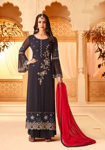 Enhance Your Personality Wearing This Designer Straight Suit In Navy Blue Color Paired With Contrasting Red Colored Dupatta. Its Heavy Embroidered Top Is Fabricated On Georgette Paired With Santoon Bottom And Chiffon Fabricated Dupatta.