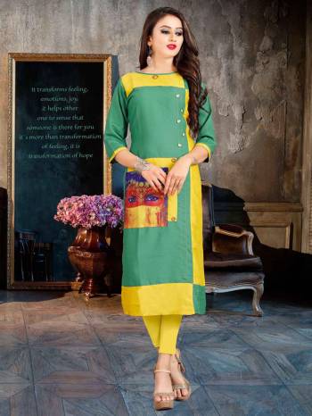 Beat The Heat This Summer With This Readymade Light Weight Kurti Fabricated On Rayon. This Kurti Is Beautified With Printed Patch And Buttons. Buy Now.