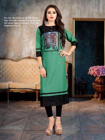 Grab This Beautiful Readymade Kurti For Your Casual Or Semi-Casual Wear, This Kurti Is Fabricated On Rayon Beautified With Printed Patch And Buttons. Buy Now.