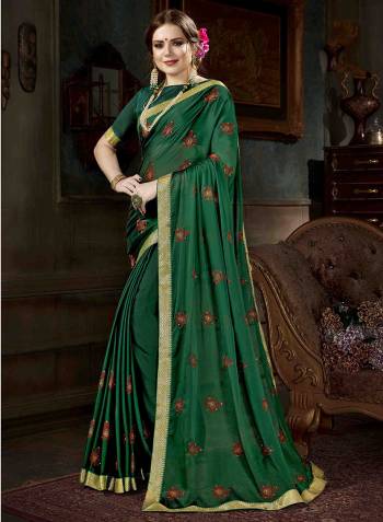 This Summer Go Easy With This Pretty Designer Saree In Green Color Paired With Green Colored Blouse. This Saree Is Fabricated On Georgette Paired With Art Silk Fabricated Blouse. It IS Beautified With Embroidered Butti All Over.